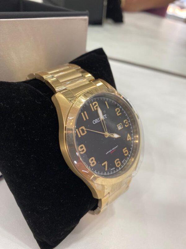 Relógio Oriente Dourado
